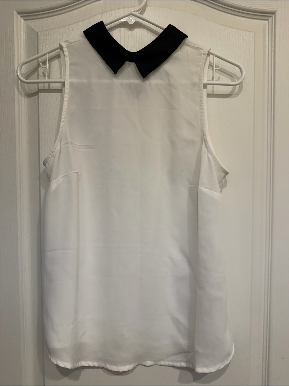 Sleeveless White Blouse with Black Contrast Collar